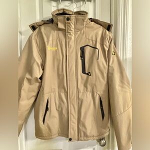 Men’s barely worn Coat Size Medium, with Hood lined with soft faux fur.